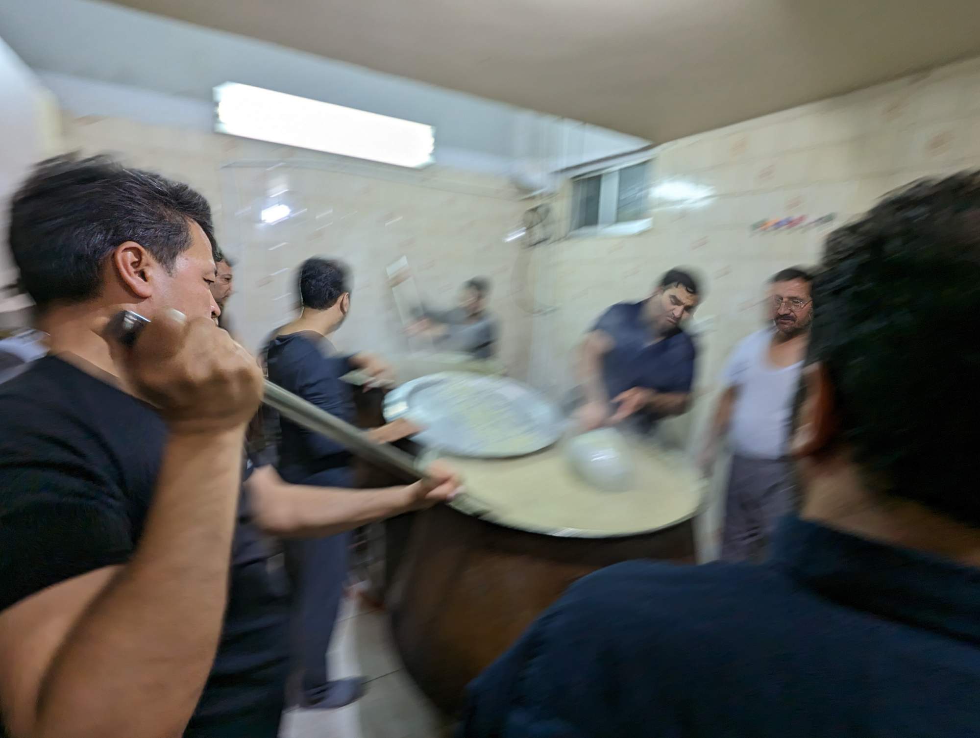 Cooking sholeh for the commemoration observance of the death of Zahra Fatemeh, daughter of Prophet Muhammad. Copyright Ali Torkzadeh, EscapefromTehran.com