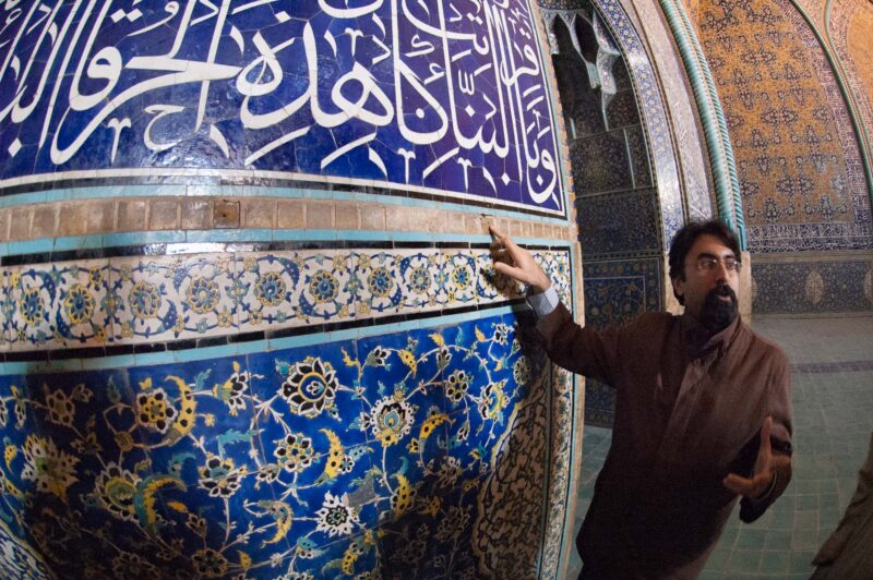 Dr. Abdulreza Soleimani, art historian, college professor, explaining the kashi (tiles) of Shah Mosque of Isfahan, Iran. Copyright Ali Torkzadeh, EscapefromTehran.com